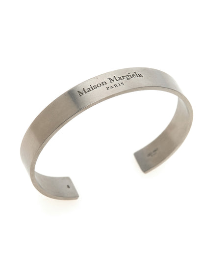 This Bracelet by Maison Margiela for women in suede calfskin leather and silver showcases a exquisite silhouette, highlighting the intricate bangle bracelet design from the Women's Bangle Silver Bracelet collection for a exquisite aesthetic.