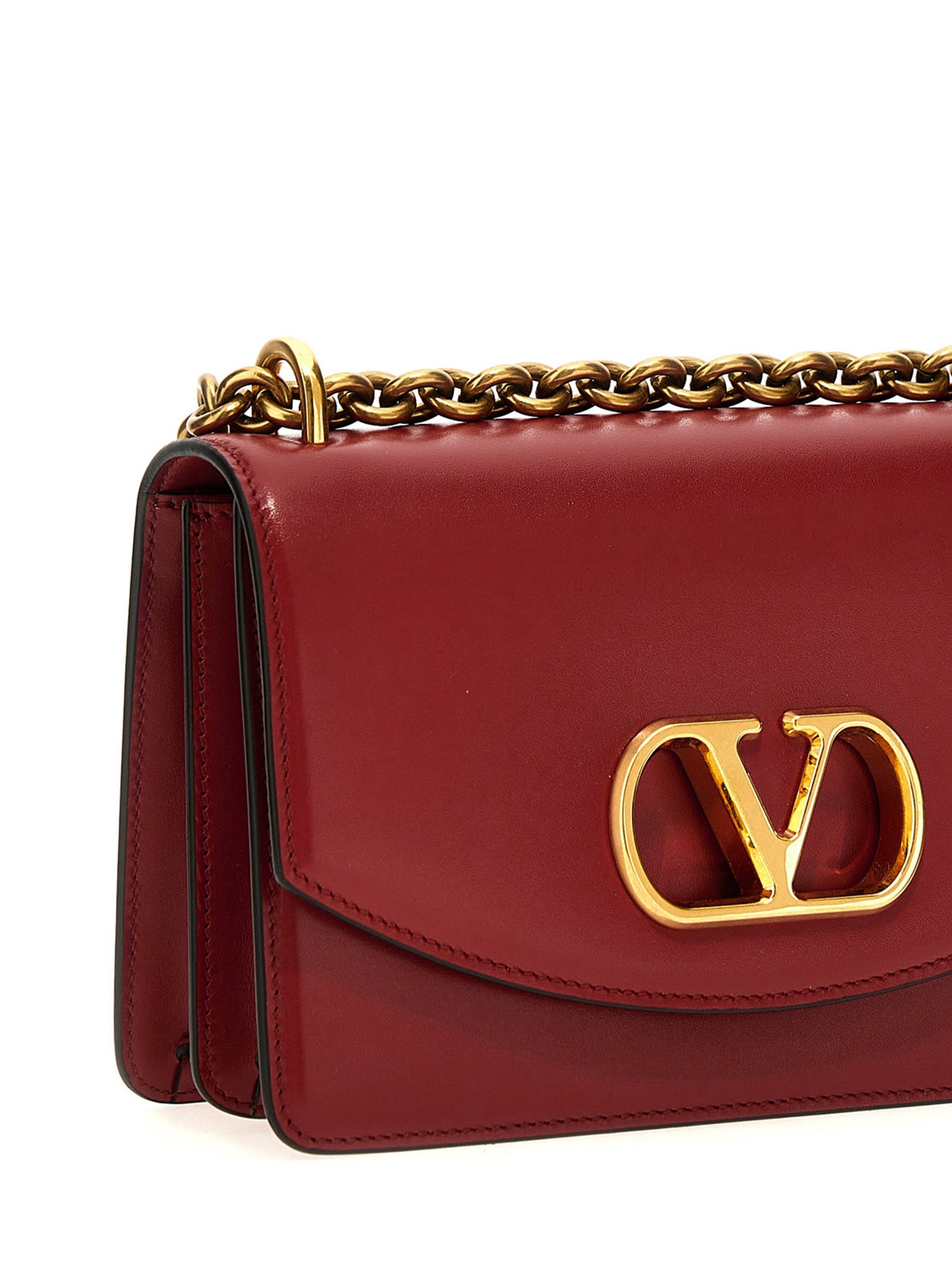 2-in-1 Shoulder & Crossbody Flap Bag by Valentino Garavani for women in calfskin leather multicolor, red & signature features an effortlessly chic silhouette with a secure flap & magnetic, ample , and versatile crossbody-strap & shoulder-strap for effortlessly chic everyday luxury.