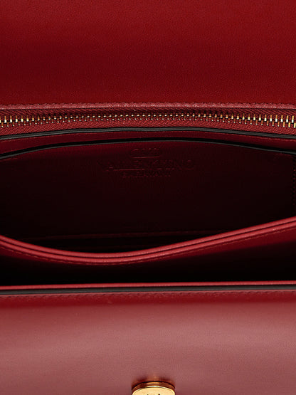 2-in-1 Shoulder & Crossbody Flap Bag by Valentino Garavani for women in calfskin leather multicolor, red & signature features a effortless sophistication silhouette, secured by a flap & magnetic with ample and versatile crossbody-strap & shoulder-strap for a effortless sophistication finish.