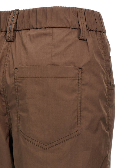 Casual Pants by Brunello Cucinelli for women in cotton brown presents a tailored silhouette, showcasing a tailored straight-leg and long cut with a refined for a truly tailored aesthetic.