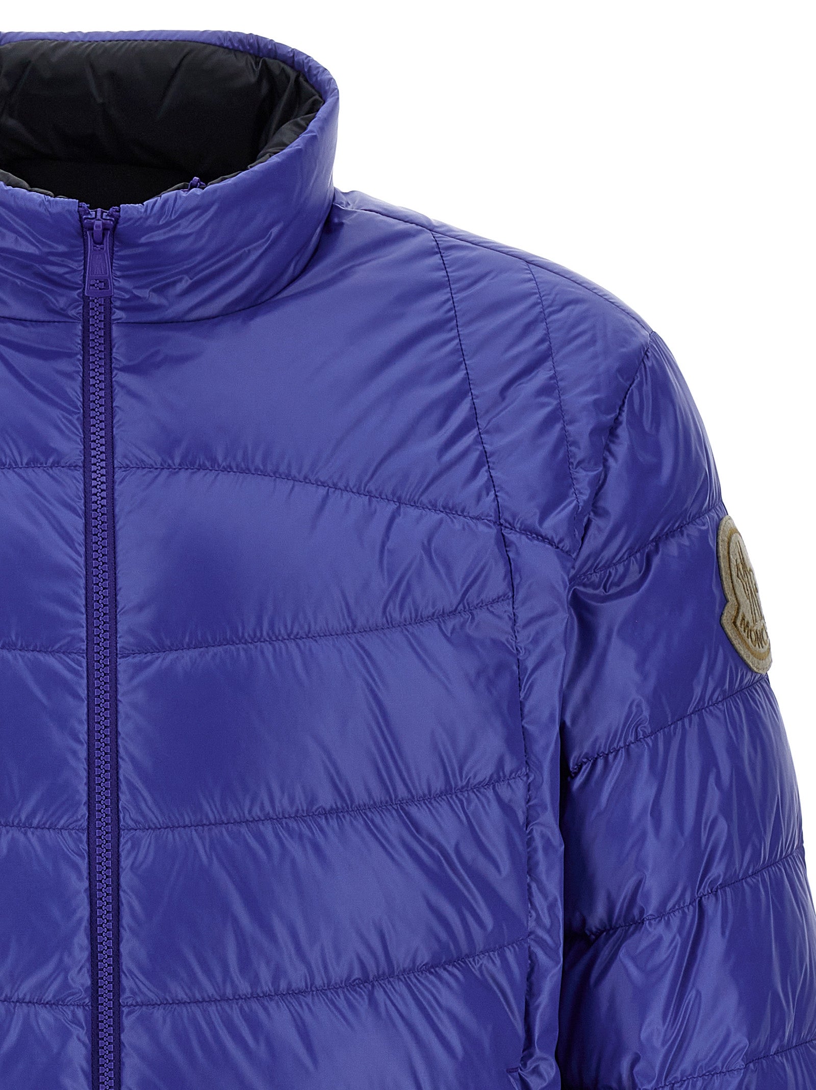 Hooded Overcoat by Moncler for men in nylon felt blue showcases a enveloping silhouette, detailed with distinctive pockets, hooded & insulated and a enveloping hooded high-neck neckline.
