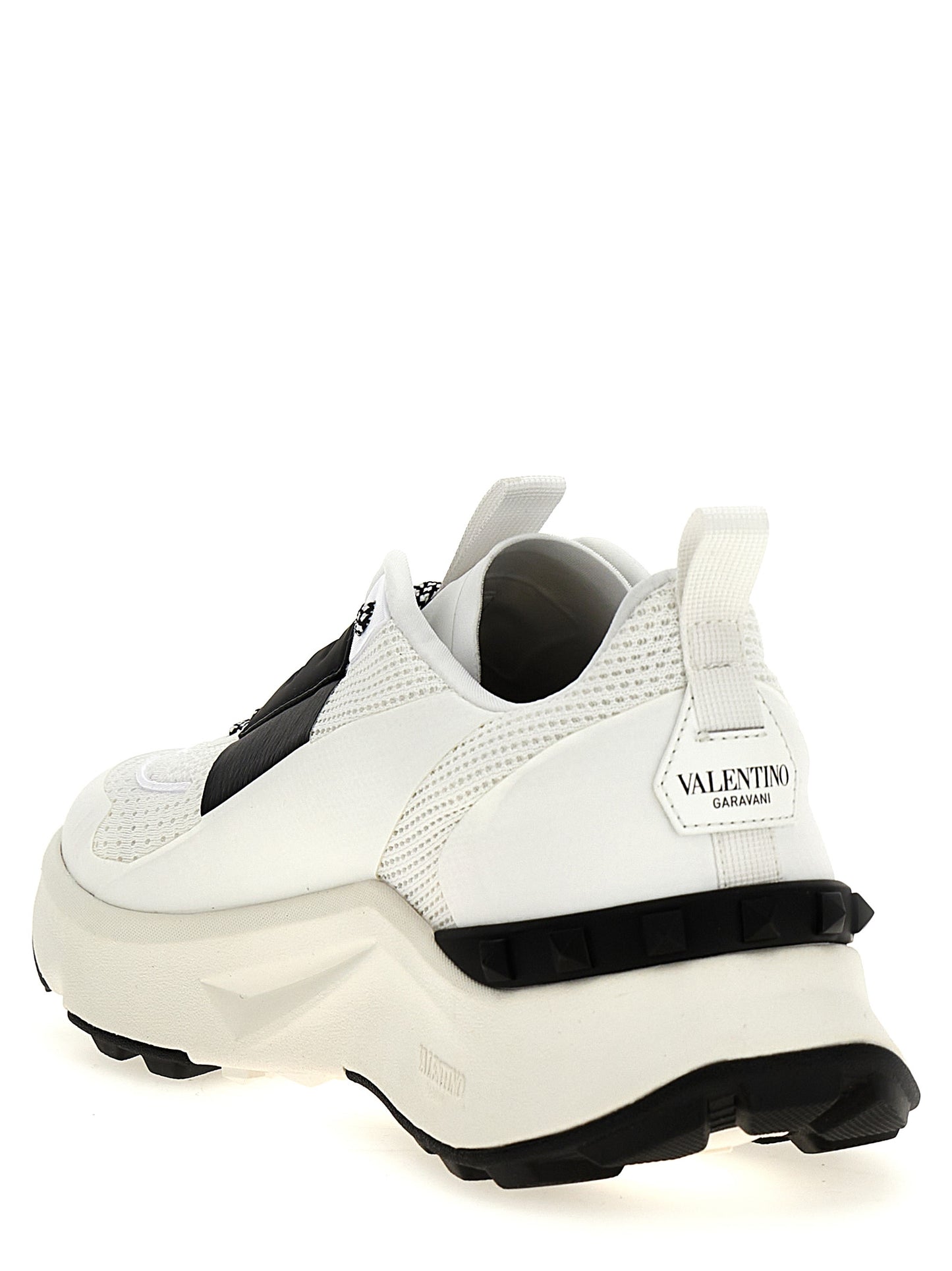 Athletic Sneakers by Valentino Garavani for men in calfskin leather bicolour, black & white presents a sleek silhouette, perfectly capturing the athletic style essence of Men's Athletic Calfskin Leather Sneakers with its sleek design and premium finish.