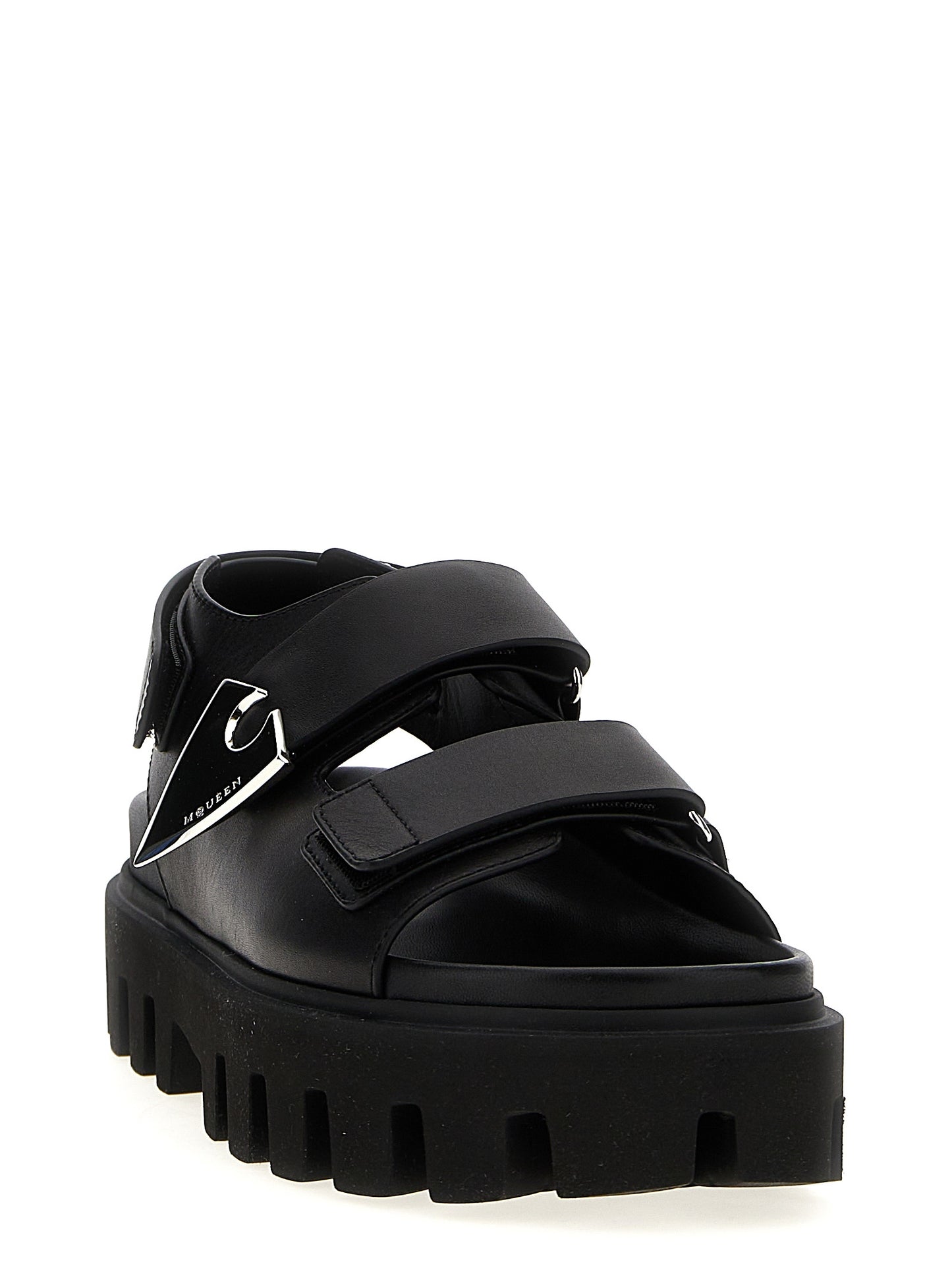 Flat Sandals by Alexander McQueen for women in bos taurus calf leather black presents a sculptural silhouette, showcasing the Women's Bos Taurus Calf Leather Flat Sandals design with a sculptural flat and for a premium look.