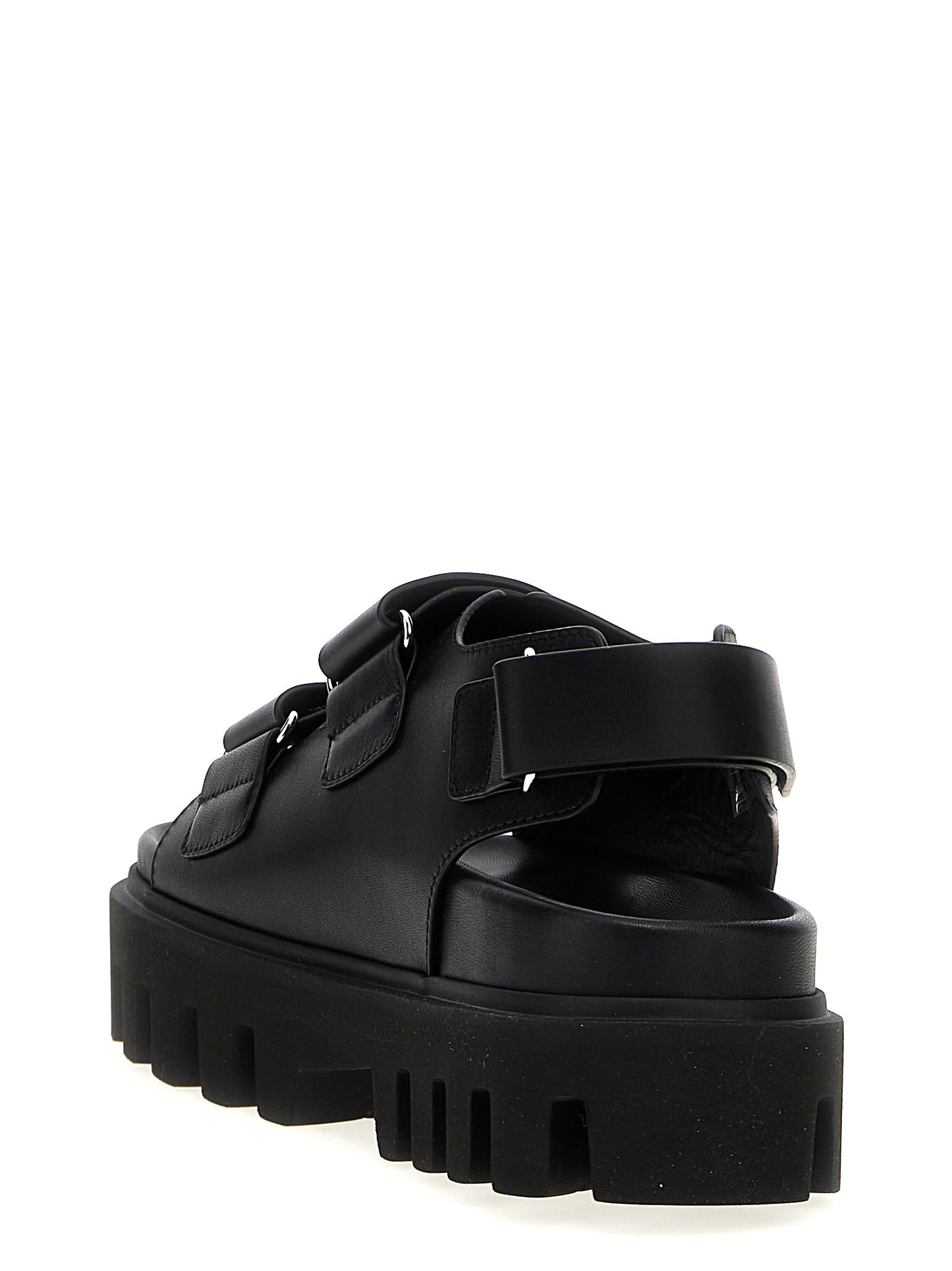 Flat Sandals by Alexander McQueen for women in bos taurus calf leather black features an exquisite silhouette, showcasing the exquisite Women's Bos Taurus Calf Leather Flat Sandals with a flat and .
