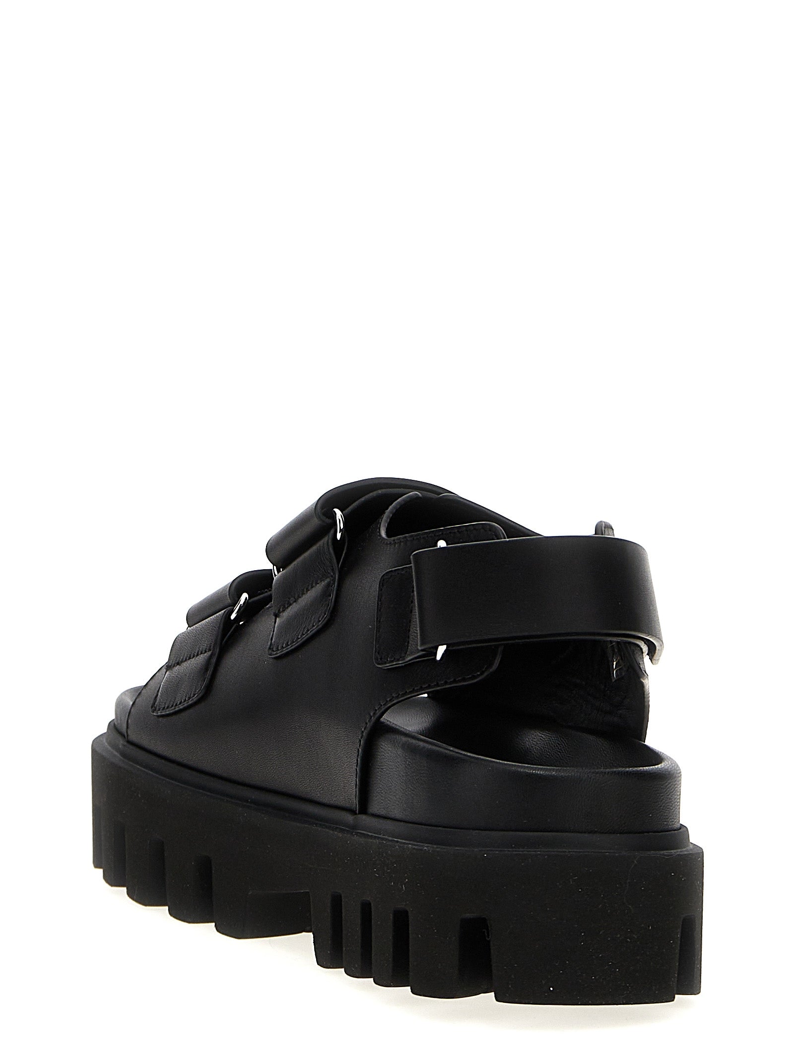 Flat Sandals by Alexander McQueen for women in bos taurus calf leather black features an exquisite silhouette, showcasing the exquisite Women's Bos Taurus Calf Leather Flat Sandals with a flat and .