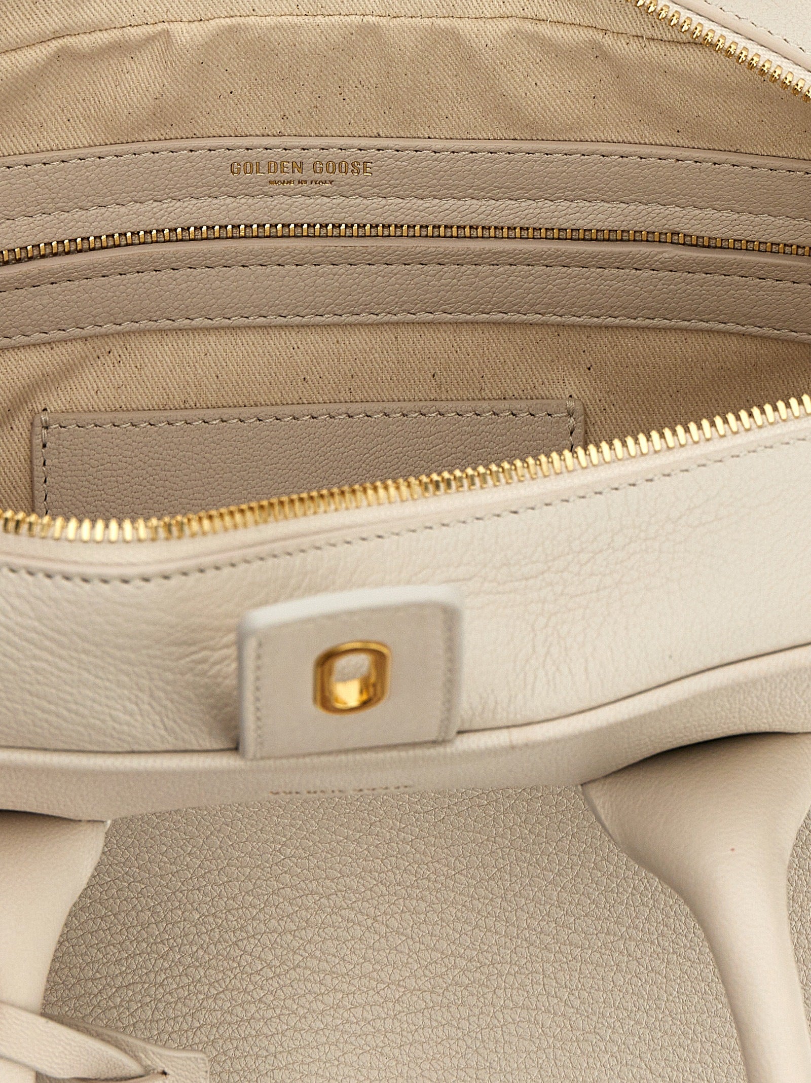 Handbag by Golden Goose for women in viscose & synthetic fur white features a ornamental silhouette, showcasing a secure zipper, ample , and ornamental shoulder-strap, adjustable-strap & handle for a sophisticated look.