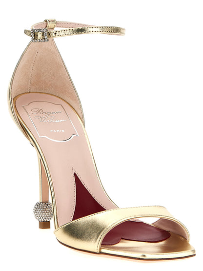 Stiletto Ankle Strap Sandals by Roger Vivier for women in calfskin leather & rhinestone gold presents a sculptural silhouette, showcasing the Marlene Women's Calfskin Leather & Rhinestone Stiletto Ankle Strap Sandals design with a sculptural stiletto and for a premium look.