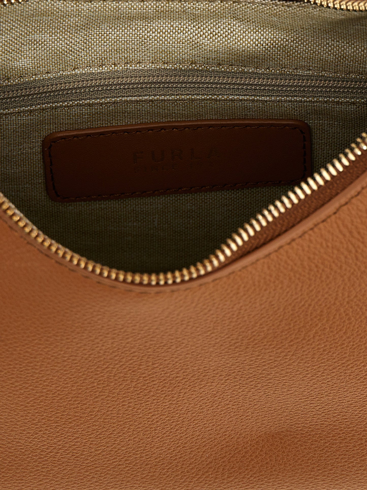 Shoulder Bag by Furla for women in leather brown features a stately silhouette, showcasing a secure zipper, ample , and stately shoulder-strap & adjustable-strap for a stately finish.