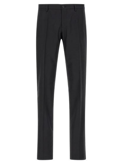 Pant Suit by Dolce & Gabbana for men in virgin wool & silk black showcases a sartorial silhouette, artfully detailed with a sophisticated and a sartorial straight-leg for a refined, high-fashion aesthetic.