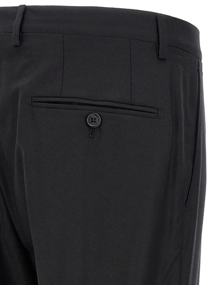 Pant Suit by Dolce & Gabbana for men in virgin wool & silk black features a tailored silhouette, showcasing a sophisticated and tailored straight-leg for a refined, professional look.