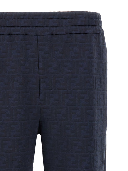 Joggers by Fendi for men in cotton polyester blue, jacquard & monogram presents a tailored silhouette, showcasing a tailored straight and long cut with a refined for a truly tailored aesthetic.