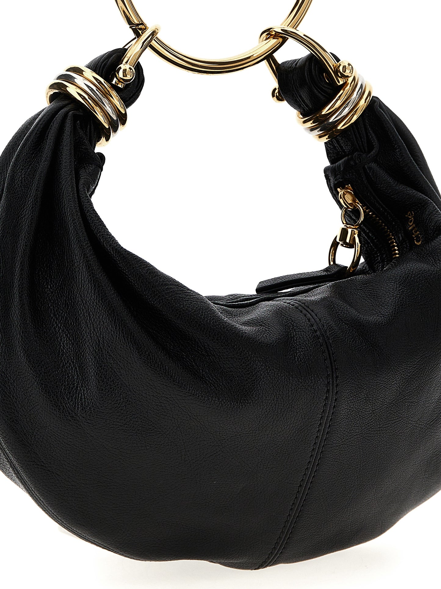 Hobo Handbag by Chloé for women in calfskin leather black features a refined silhouette, showcasing a secure zipper, organized , and versatile shoulder-strap, adjustable-strap, detachable-strap & handle for a refined finish.