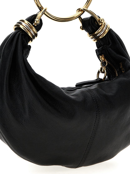 Hobo Handbag by Chloé for women in calfskin leather black features a refined silhouette, showcasing a secure zipper, organized , and versatile shoulder-strap, adjustable-strap, detachable-strap & handle for a refined finish.