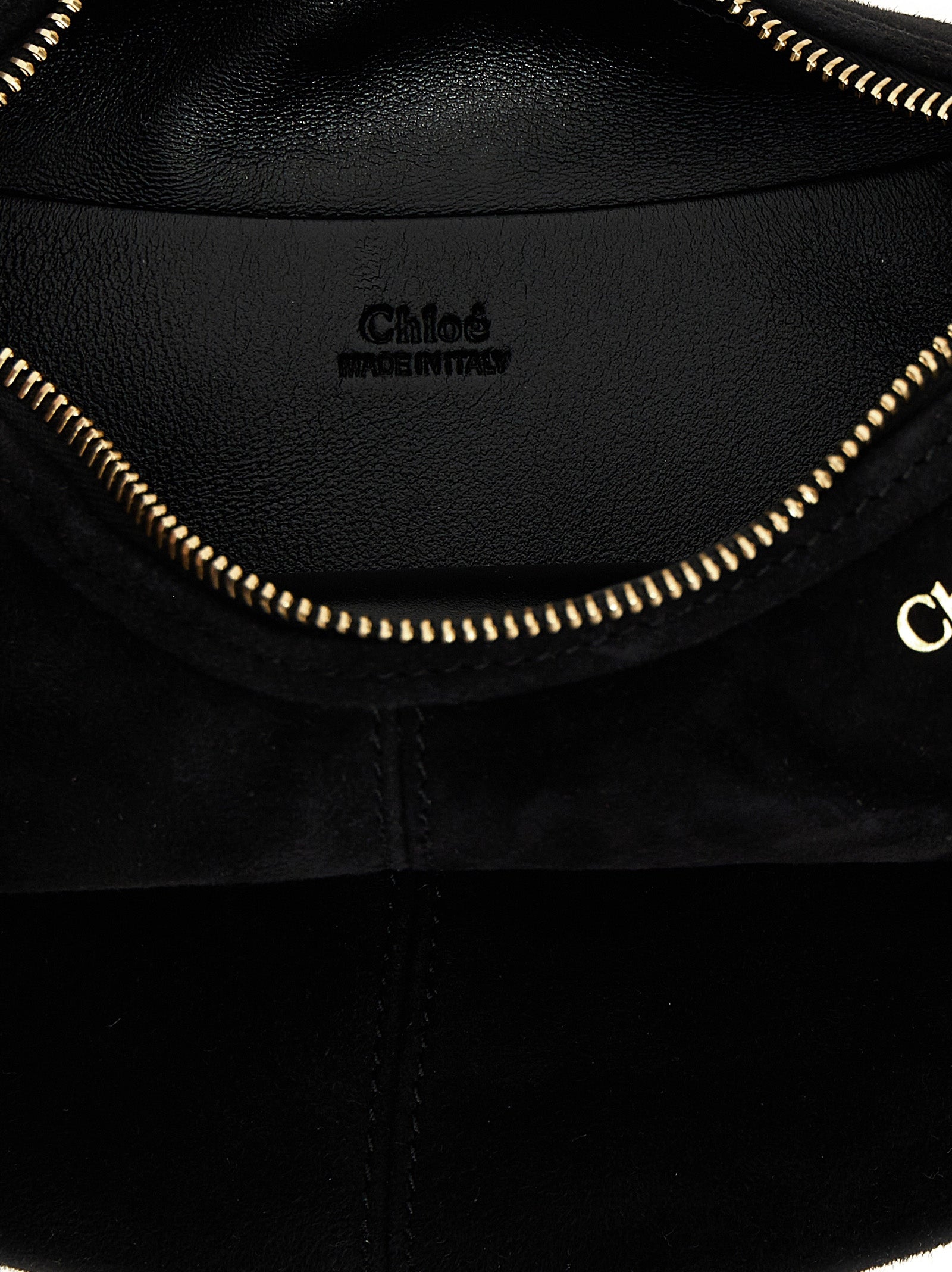 Mini Hobo Handbag by Chloé for women in plush viscose goat leather & fur black features a contemporary silhouette, showcasing a secure zipper, ample , and contemporary shoulder-strap, adjustable-strap & handle for a sophisticated look.