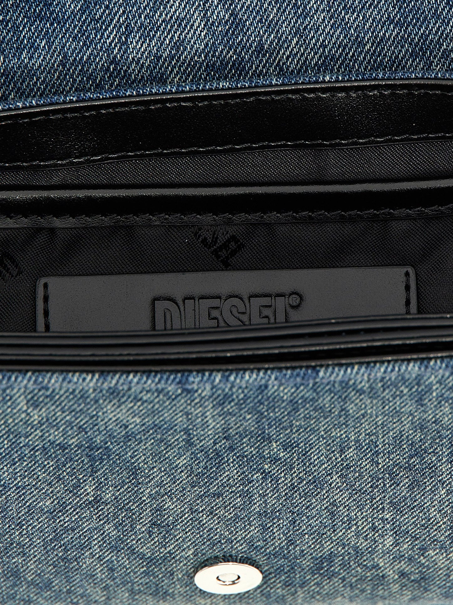 Shoulder Flap Bag by Diesel for women in denim cotton blue showcases a statuesque silhouette, artfully detailed with a secure flap & magnetic, organized , and versatile shoulder-strap & adjustable-strap for a statuesque look.
