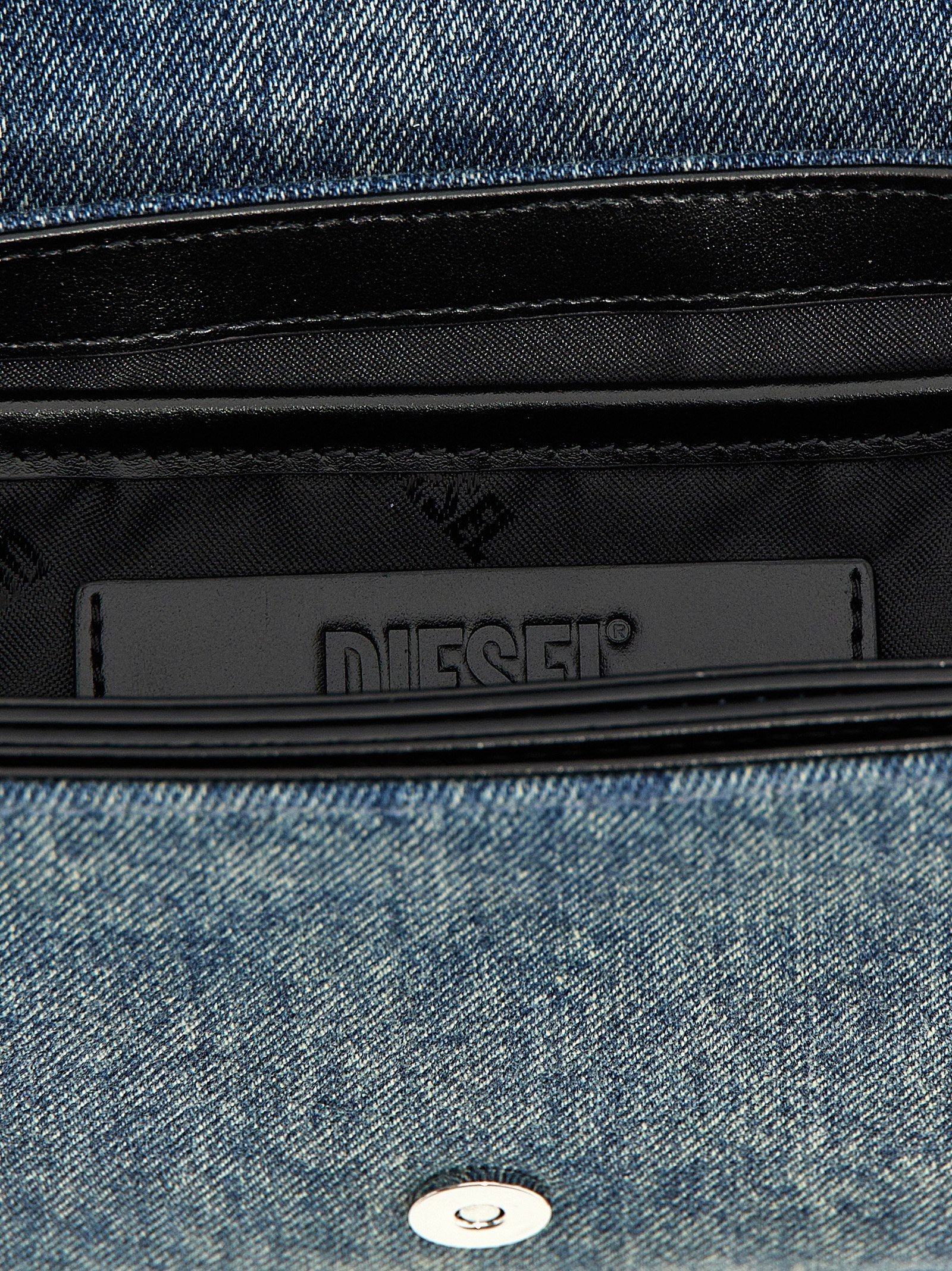 Shoulder Flap Bag by Diesel for women in denim cotton blue showcases a statuesque silhouette, artfully detailed with a secure flap & magnetic, organized , and versatile shoulder-strap & adjustable-strap for a statuesque look.