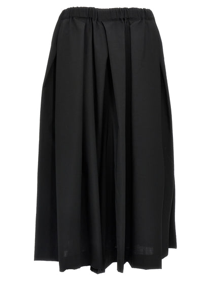 Skirt by Comme Des Garçons for women in wool black showcases a dramatic silhouette, artfully capturing the essence of the Women's Wool Skirt in a dramatic midi cut for a refined look.