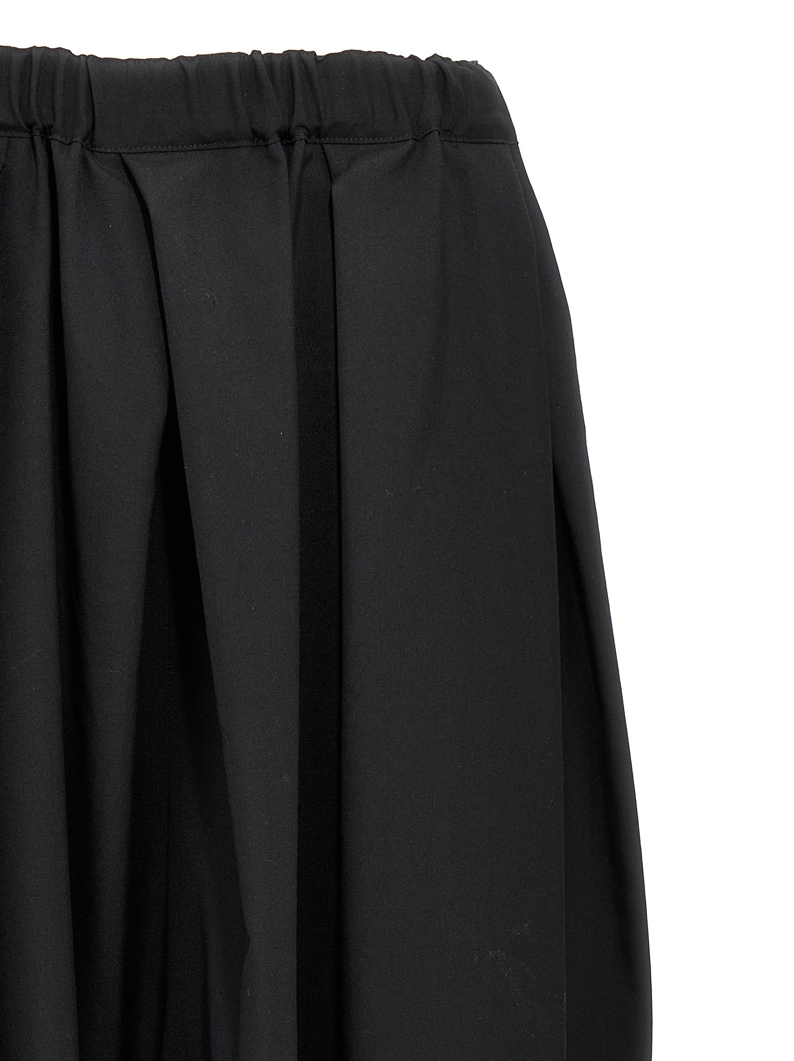 Skirt by Comme Des Garçons for women in wool black features a captivating silhouette, showcasing the captivating Women's Wool Skirt design with a sophisticated midi for a captivating look.