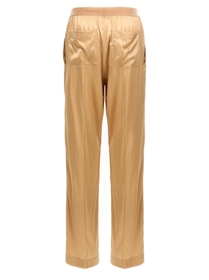 Trousers by Tom Ford for women in silk velvet beige features a artisanal silhouette, showcasing a sophisticated straight-leg with a long and for a artisanal finish.