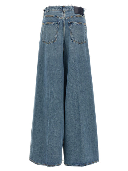 Jeans by Haikure for women in denim cotton blue features a polished silhouette with a polished relaxed-fit & wide, reaching a polished long and finished with a polished .