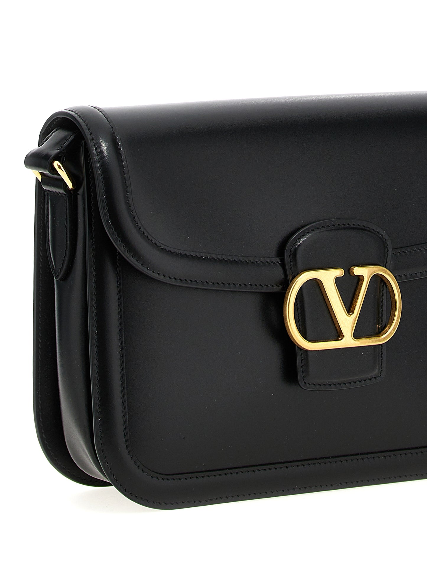 Shoulder Evening Saddle Bag by Valentino Garavani for men in bos taurus suede calfskin leather black & signature features an effortlessly chic silhouette with a secure flap, magnetic & buckle, ample , and versatile shoulder-strap & adjustable-strap for effortlessly chic everyday luxury.