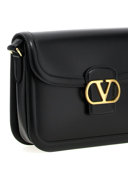 Shoulder Evening Saddle Bag by Valentino Garavani for men in bos taurus suede calfskin leather black & signature features an effortlessly chic silhouette with a secure flap, magnetic & buckle, ample , and versatile shoulder-strap & adjustable-strap for effortlessly chic everyday luxury.