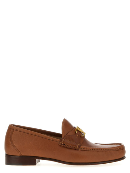 Loafer Slip-On Shoes by Valentino Garavani for men in buffalo leather brown & signature showcases a impeccable silhouette as V Logo Men's Buffalo Leather Loafer Slip-On Shoes, artfully designed with a impeccable and refined for a impeccable finish.