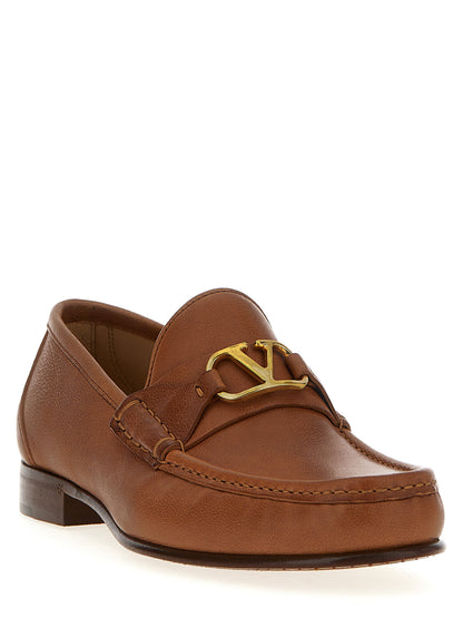 Loafer Slip-On Shoes by Valentino Garavani for men in buffalo leather brown & signature showcases a timeless silhouette from the V Logo Men's Buffalo Leather Loafer Slip-On Shoes collection, featuring a timeless and for a timeless finish.