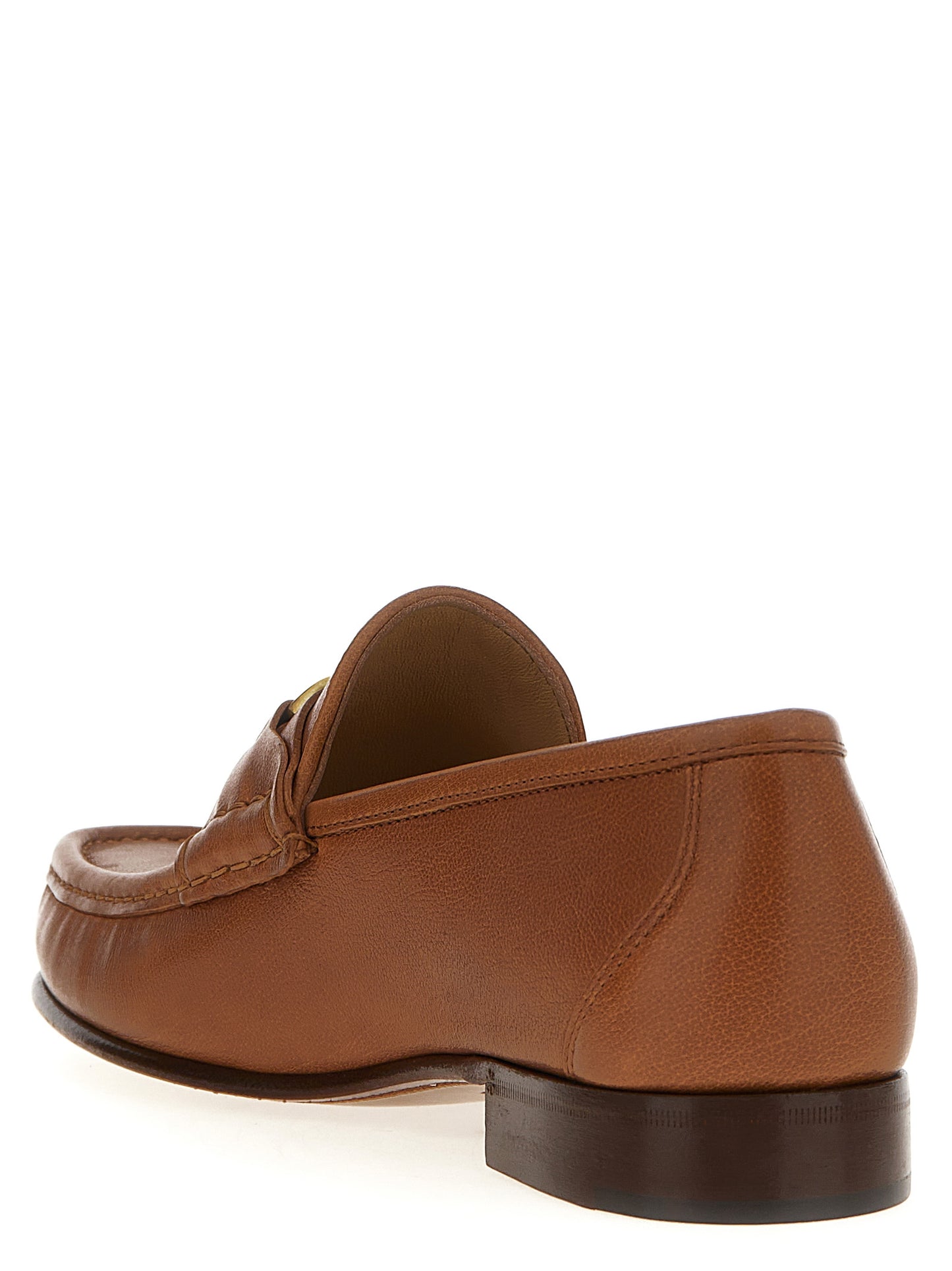 This Loafer Slip-On Shoes by Valentino Garavani for men in buffalo leather brown & signature features an exquisite silhouette from the V Logo Men's Buffalo Leather Loafer Slip-On Shoes collection, defined by a sophisticated and elegant .