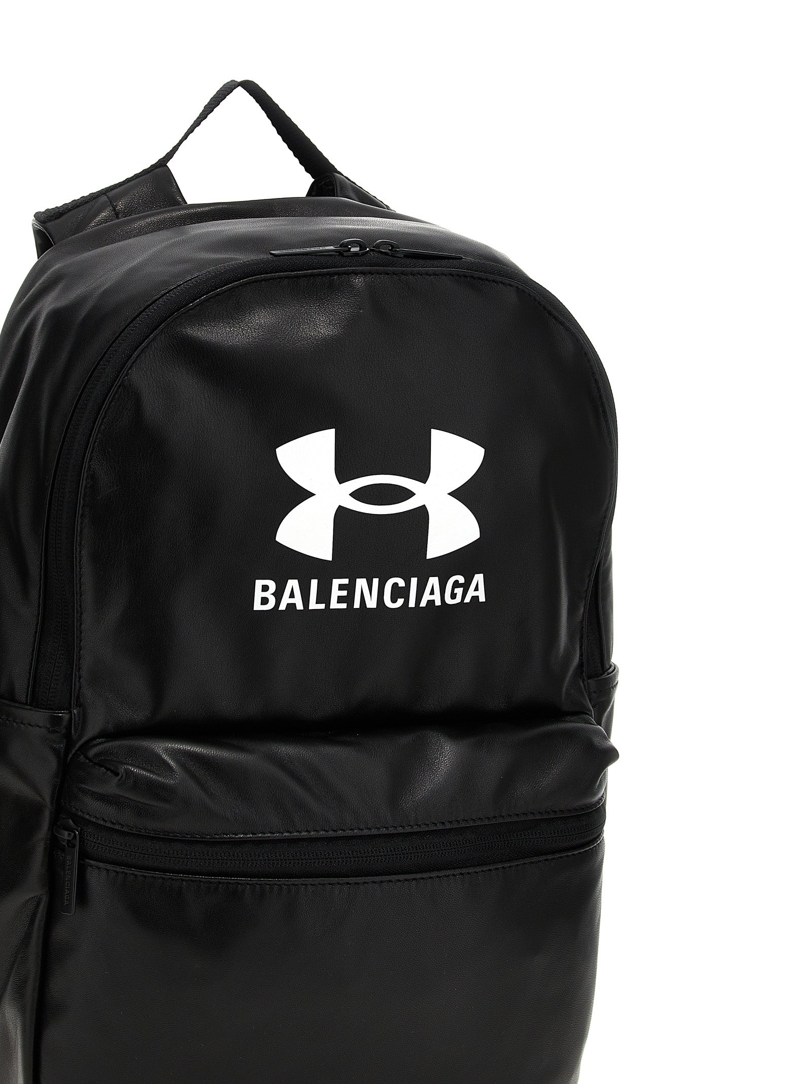 Backpack by Balenciaga for men in polyester & lamb leather bicolour, black, white & print showcases an architectural Polyester & Lamb Leather Backpack design, featuring a secure zipper, ample external-pockets, and architectural handle, backpack-strap & adjustable-strap for a sophisticated look.