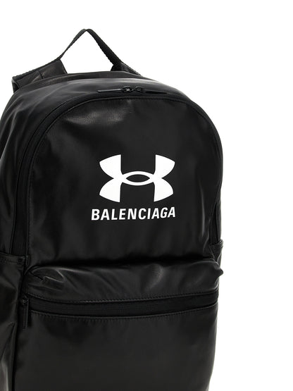 Backpack by Balenciaga for men in polyester & lamb leather bicolour, black, white & print showcases an architectural Polyester & Lamb Leather Backpack design, featuring a secure zipper, ample external-pockets, and architectural handle, backpack-strap & adjustable-strap for a sophisticated look.