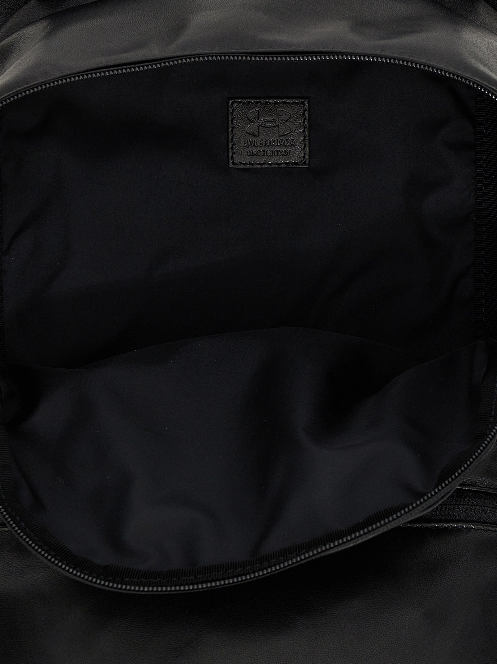 Backpack by Balenciaga for men in polyester & lamb leather bicolour, black, white & print features a utilitarian chic Polyester & Lamb Leather Backpack design with a secure zipper, ample external-pockets, and versatile handle, backpack-strap & adjustable-strap for a utilitarian chic finish.