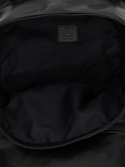 Backpack by Balenciaga for men in polyester & lamb leather bicolour, black, white & print features a utilitarian chic Polyester & Lamb Leather Backpack design with a secure zipper, ample external-pockets, and versatile handle, backpack-strap & adjustable-strap for a utilitarian chic finish.