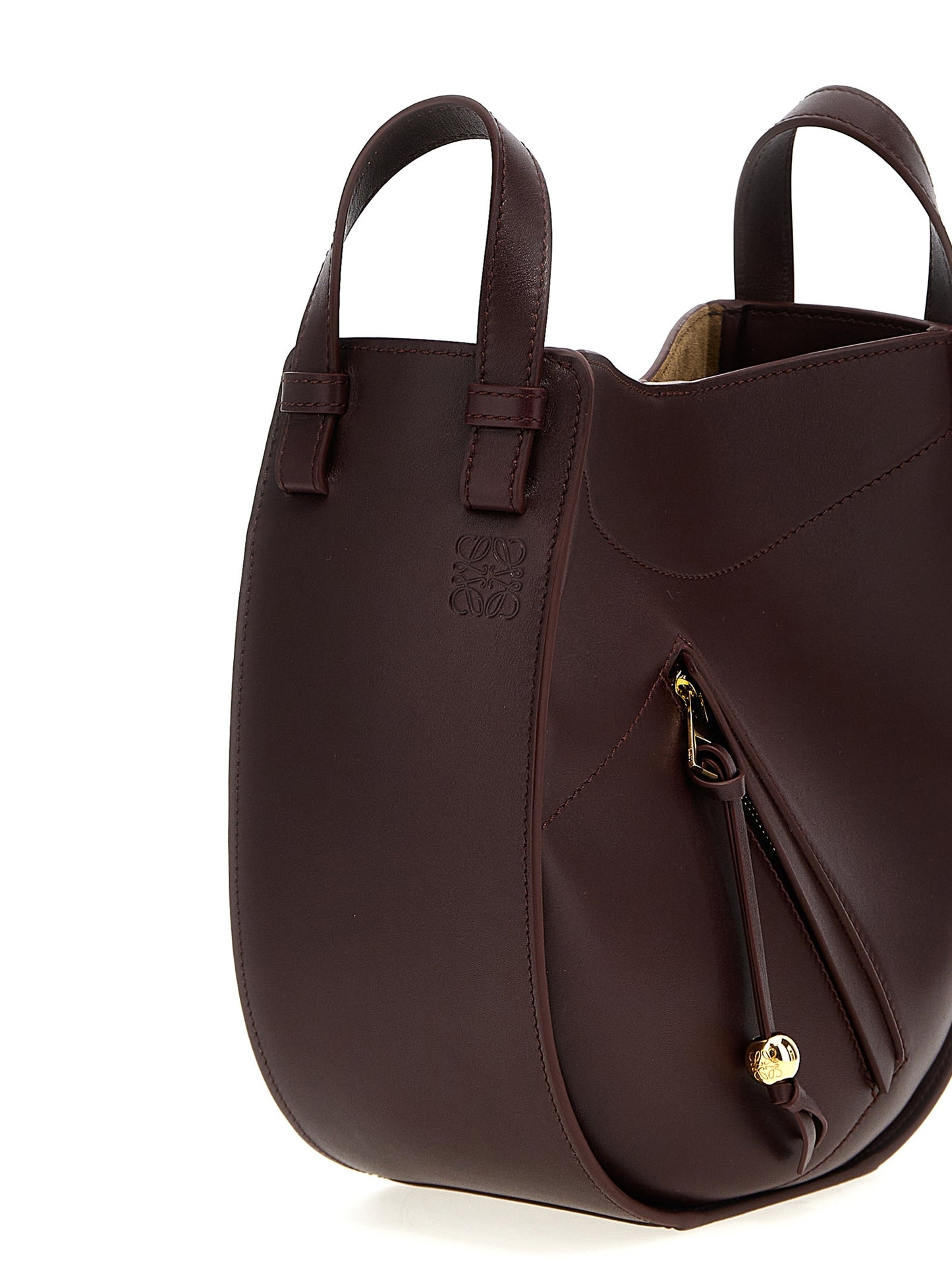 Crossbody Handbag by Loewe for women in calfskin leather bordeaux features a transformative elegance silhouette, showcasing a secure zipper & magnetic, organized , and versatile crossbody-strap, shoulder-strap & adjustable-strap for a transformative elegance look.