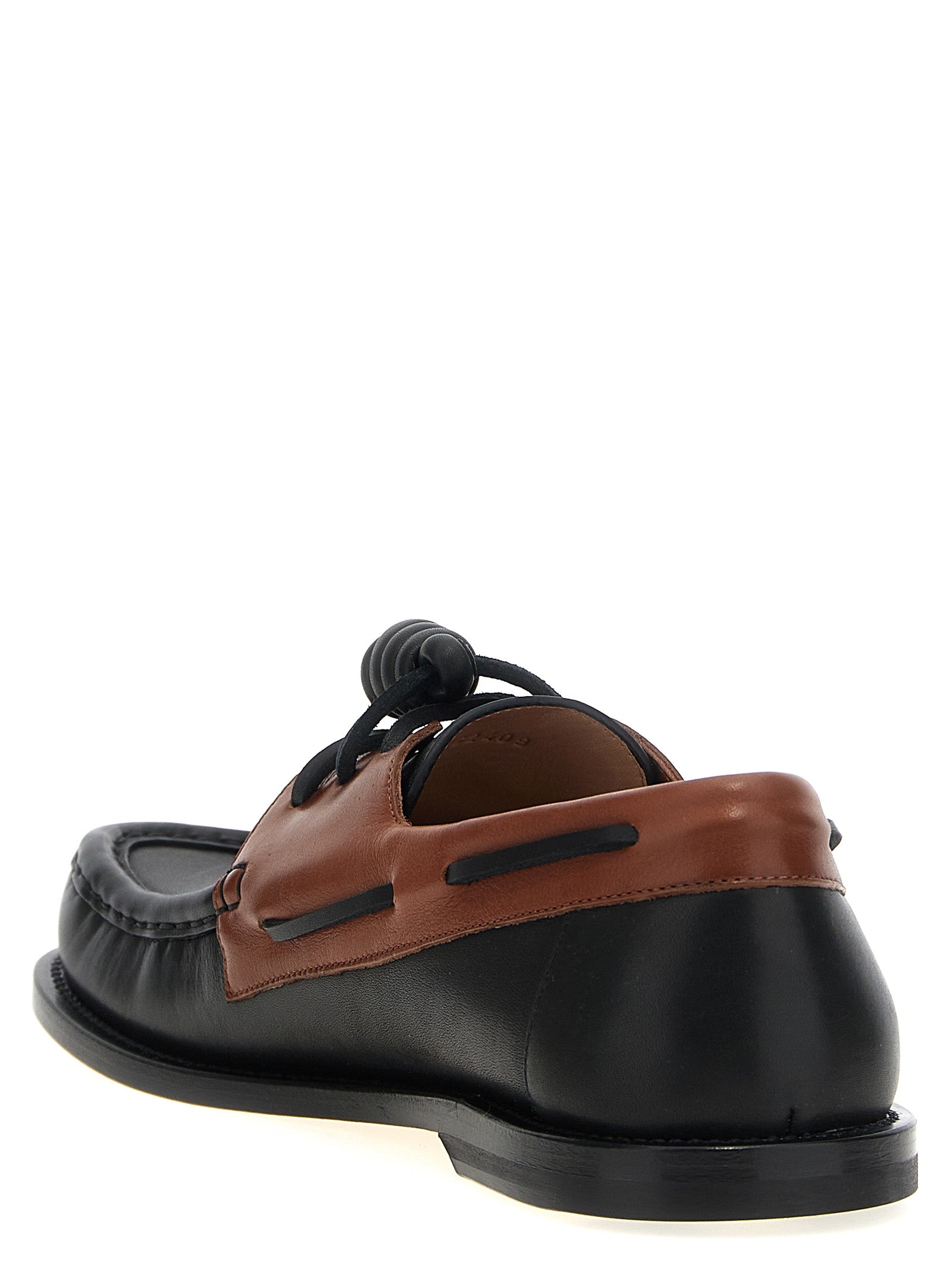 Boat Loafer Slip-On Lace-Up Shoes by Loewe for men in bos taurus calfskin leather multicolor showcases a impeccable silhouette as Men's Bos Taurus Calfskin Leather Boat Loafer Slip-On Lace-Up Shoes, artfully designed with a impeccable and refined for a impeccable finish.