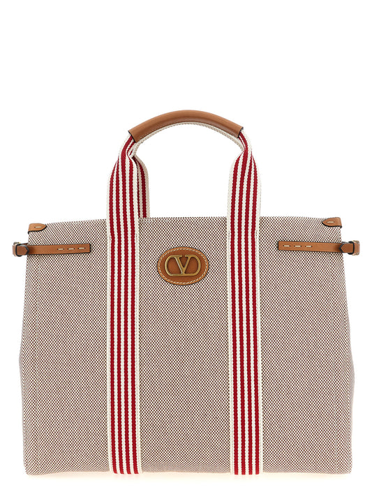 Handbag by Valentino Garavani for unisex in cotton & leather multicolor & signature features a refined silhouette, showcasing a secure magnetic, organized , and versatile adjustable-strap & handle for a refined finish.