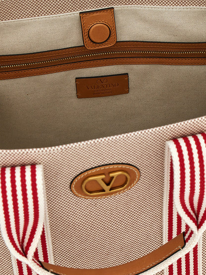 Handbag by Valentino Garavani for unisex in cotton & leather multicolor & signature features a exquisite silhouette, showcasing a secure magnetic and exquisite with versatile adjustable-strap & handle for a exquisite finish.