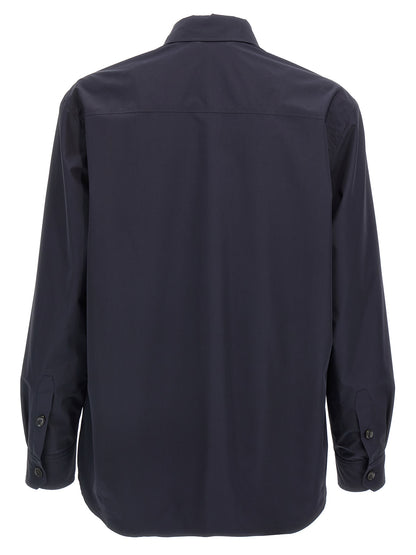 Jacket by Brioni for men in silk blue features a smart silhouette, perfectly accentuated by its unique wrap shirt-collar neckline and functional pockets for a smart finish.