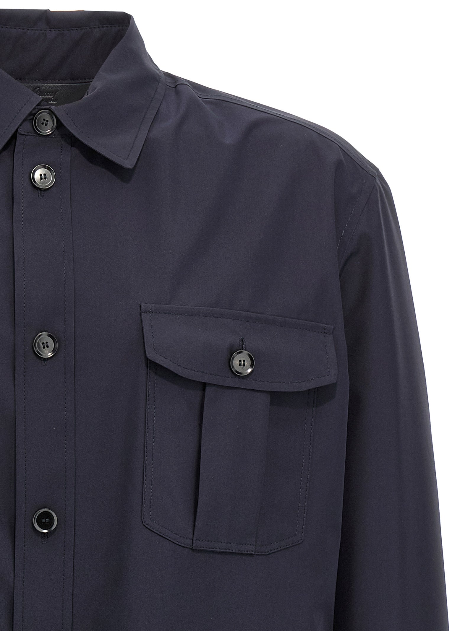 Jacket by Brioni for men in silk blue features an utilitarian silhouette with a refined wrap shirt-collar neckline, showcasing sophisticated pockets for an utilitarian aesthetic.