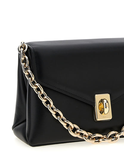 Shoulder Evening Saddle Bag by Furla for women in leather & metal black & signature features an effortlessly chic silhouette with a secure flap, ample , and versatile shoulder-strap, adjustable-strap & handle for effortlessly chic everyday luxury.