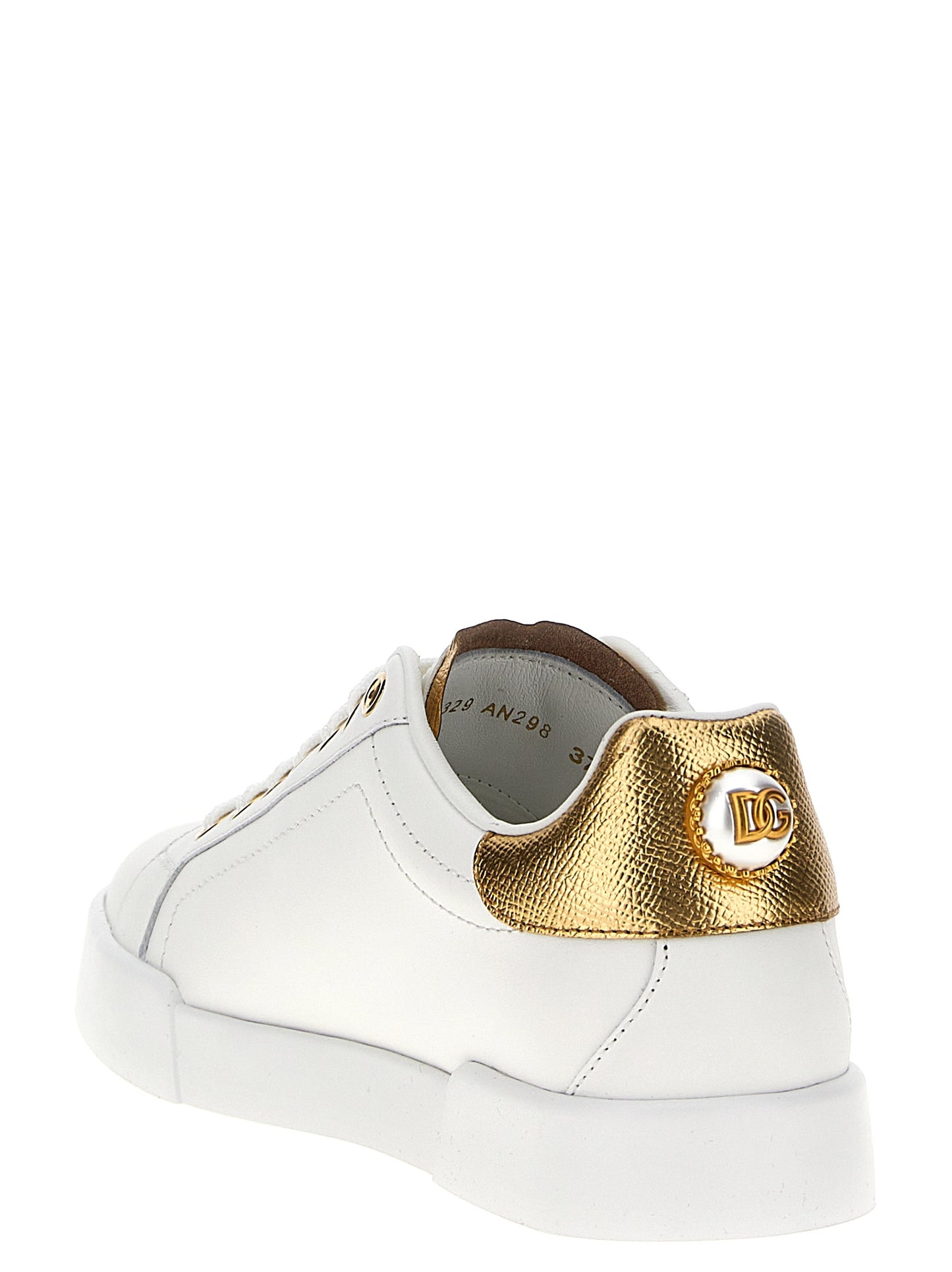 Sneakers by Dolce & Gabbana for women in calfskin leather gold & pearl presents a on trend silhouette from the Women's Low Top Calfskin Leather Sneakers collection, showcasing a on trend low-top style for an elevated aesthetic.