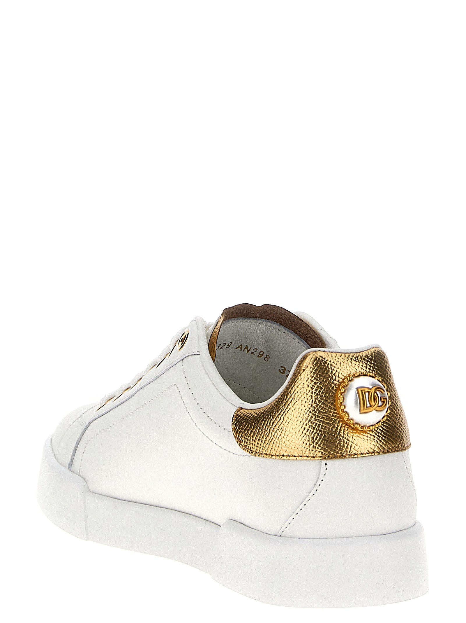 Sneakers by Dolce & Gabbana for women in calfskin leather gold & pearl presents a on trend silhouette from the Women's Low Top Calfskin Leather Sneakers collection, showcasing a on trend low-top style for an elevated aesthetic.