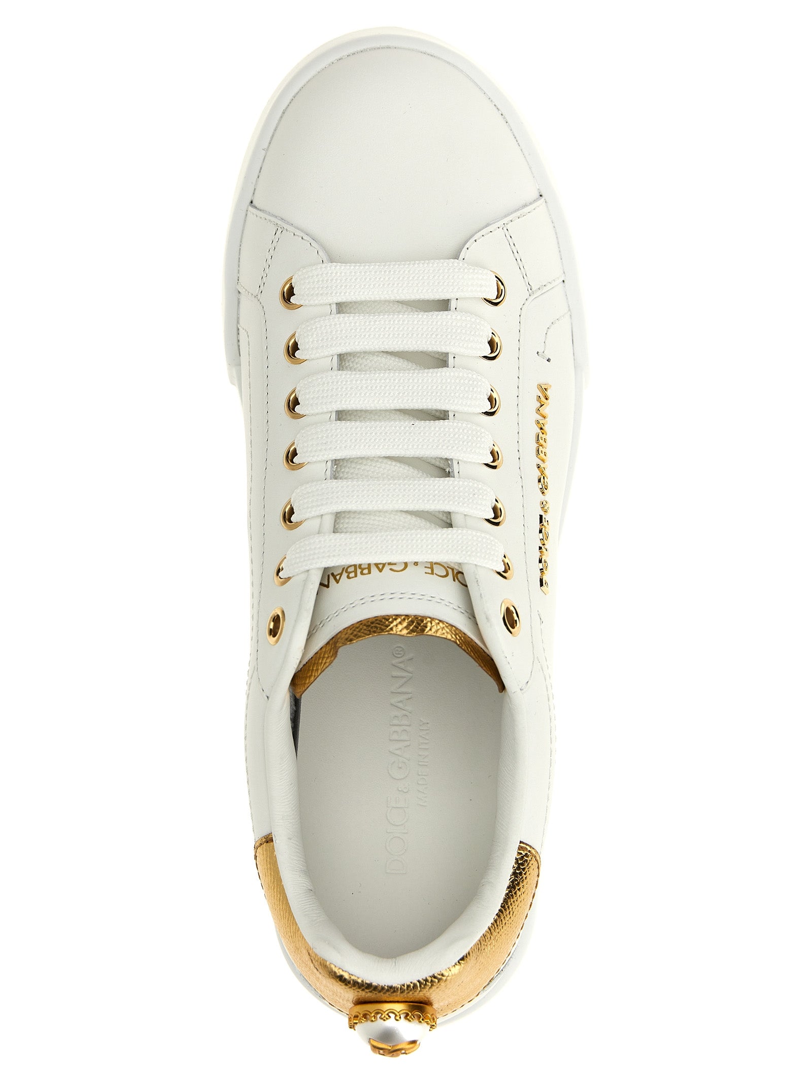 Sneakers by Dolce & Gabbana for women in calfskin leather gold & pearl presents a impeccable silhouette as Women's Low Top Calfskin Leather Sneakers, expertly defined by a impeccable low-top style for a impeccable, high-fashion look.