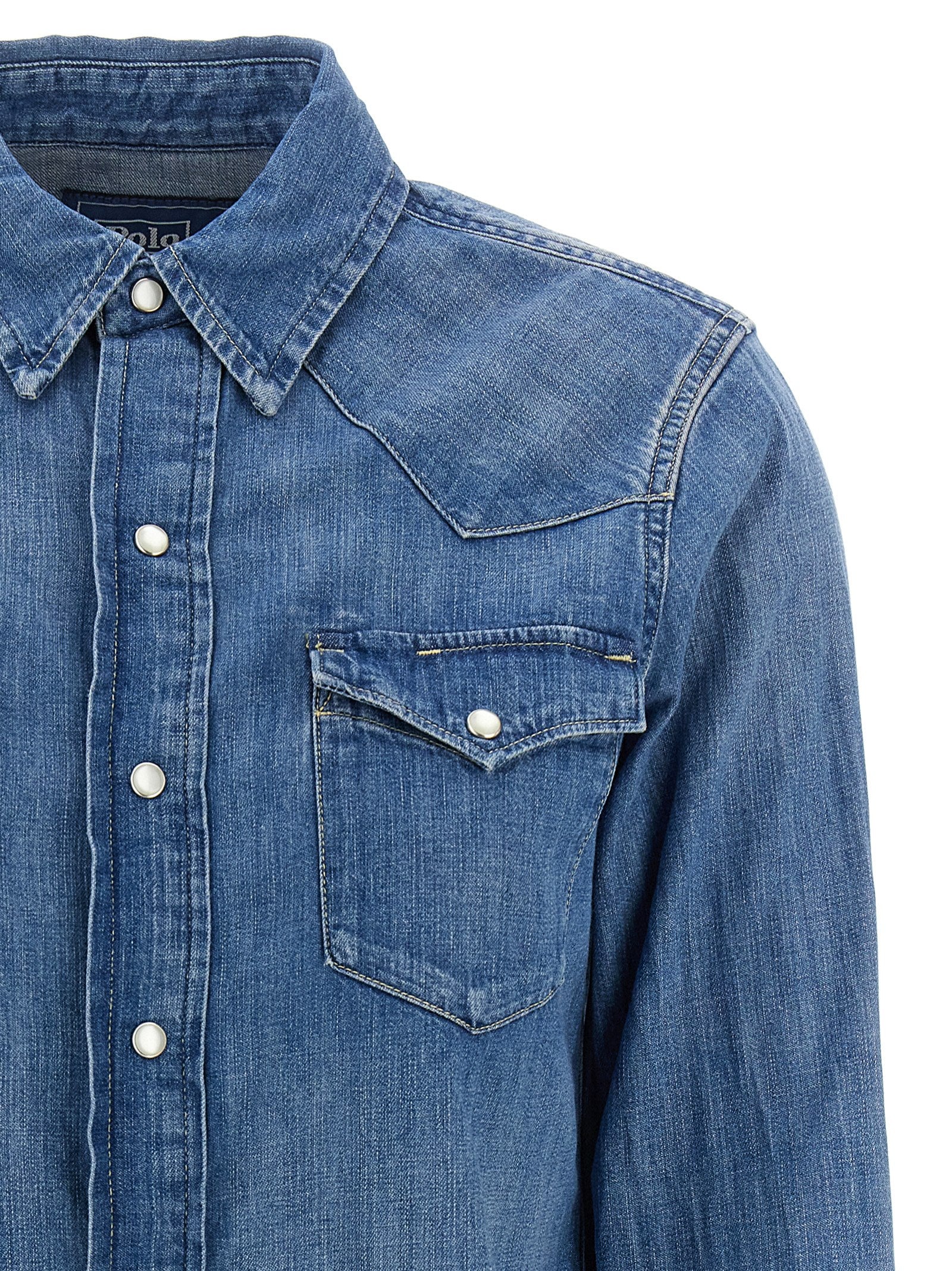 Blouse by Polo Ralph Lauren for women in denim cotton blue presents a discerning silhouette, showcasing a sophisticated and for a truly discerning finish.