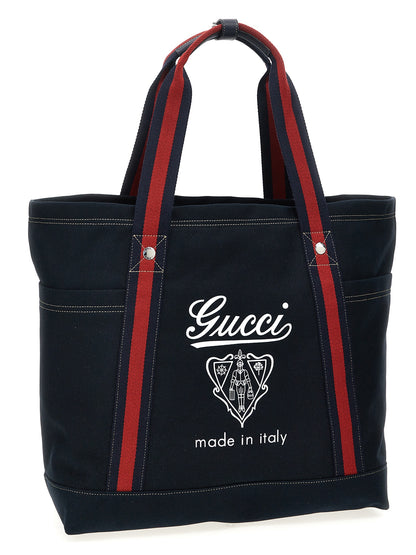 Large Shopper Tote Bag by Gucci for men in cotton & leather blue, signature & print showcases a urban-chic Cotton & Leather Large Shopper Tote Bag design, featuring a secure zipper, ample , and versatile handle for a urban-chic finish.