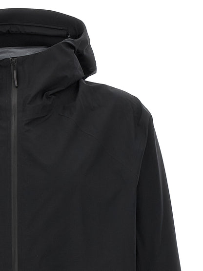 Hooded Windbreaker Jacket by Arc'teryx Veilance for men in nylon & silicone black features an perennial silhouette with a refined hooded neckline and perennial lightweight, pockets, hooded & windproof for a sophisticated weather-resistant look.