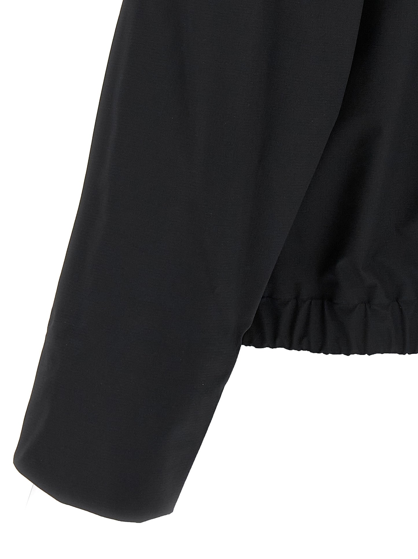 Hooded Windbreaker Jacket by Arc'teryx Veilance for men in nylon & silicone black features an enduring silhouette, showcasing technical lightweight, pockets, hooded & windproof and a sophisticated for a truly enduring aesthetic.