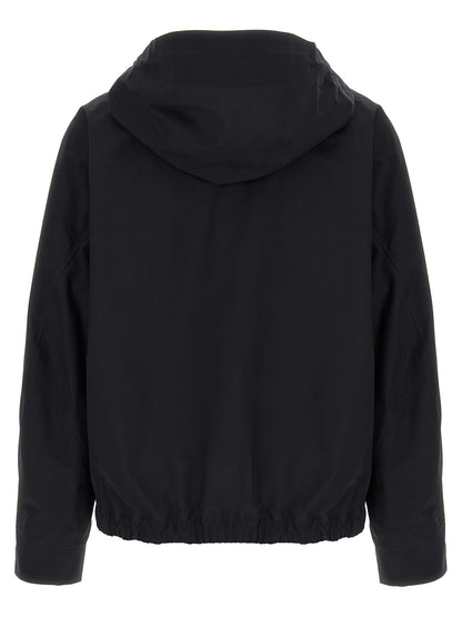 Hooded Windbreaker Jacket by Arc'teryx Veilance for women in nylon & silicone black presents a resilient silhouette, artfully detailed with a sophisticated hooded neckline and functional water-resistant, windproof, lightweight, pockets & hooded for a resilient finish.