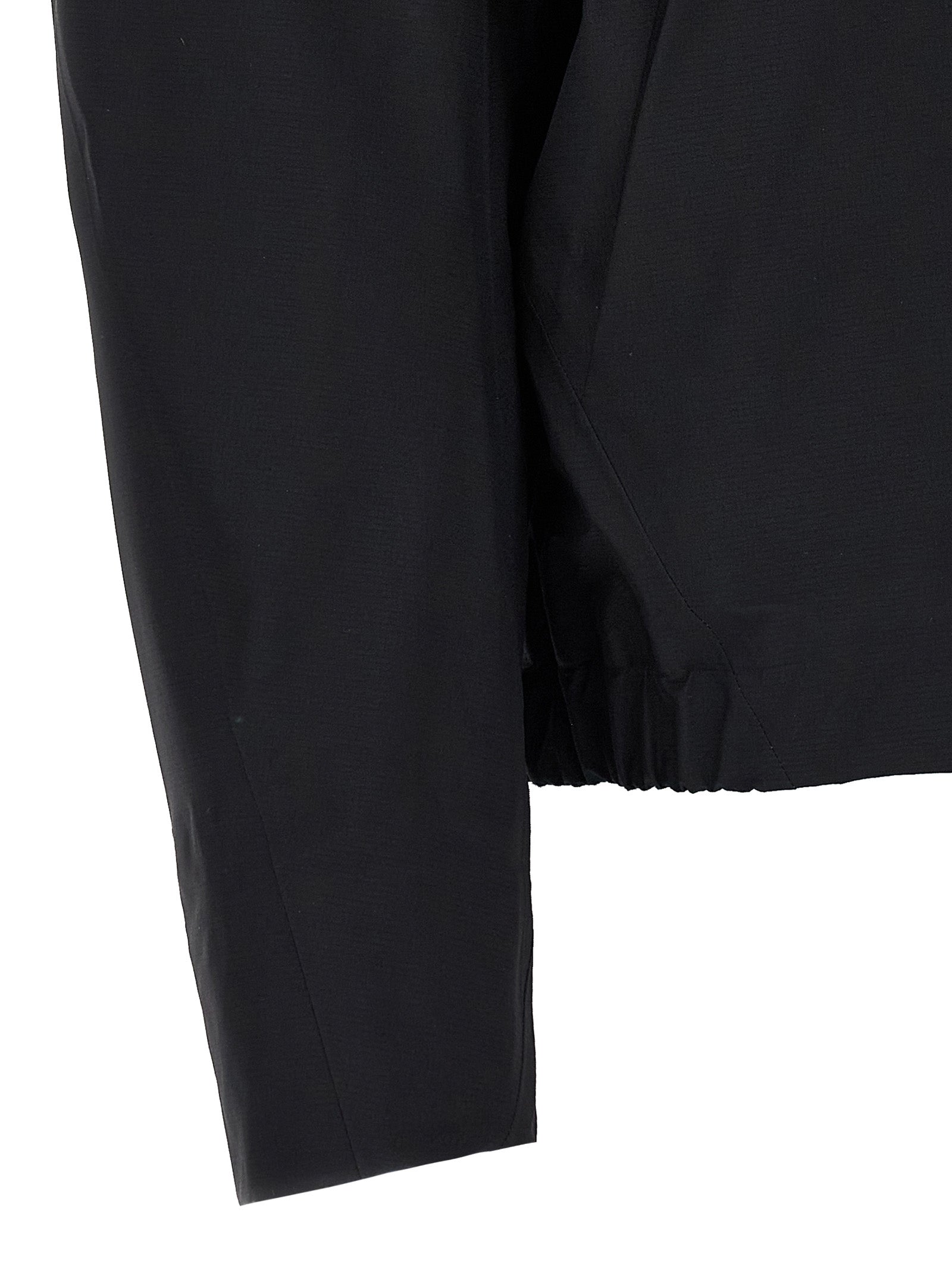 Hooded Windbreaker Jacket by Arc'teryx Veilance for women in nylon & silicone black features an perennial silhouette with a refined and perennial water-resistant, windproof, lightweight, pockets & hooded for a sophisticated weather-resistant look.