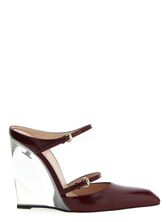 Wedge Sandals by Gucci for women in leather & metal multicolor, red & transparent presents a sculptural silhouette, showcasing the Women's Leather & Metal Wedge Sandals design with a sculptural wedge and for a premium look.